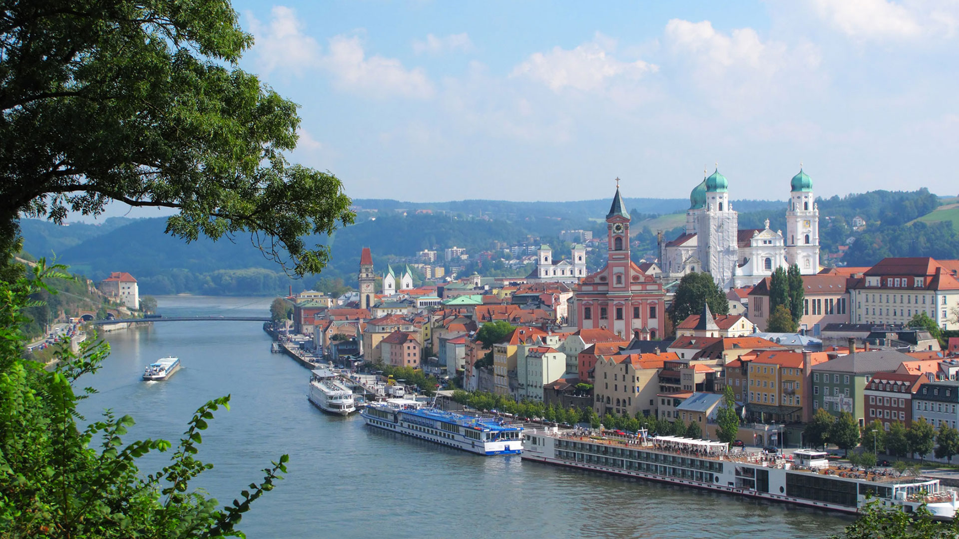 River cruise ships moored along the waterfront of Passau, Germany
